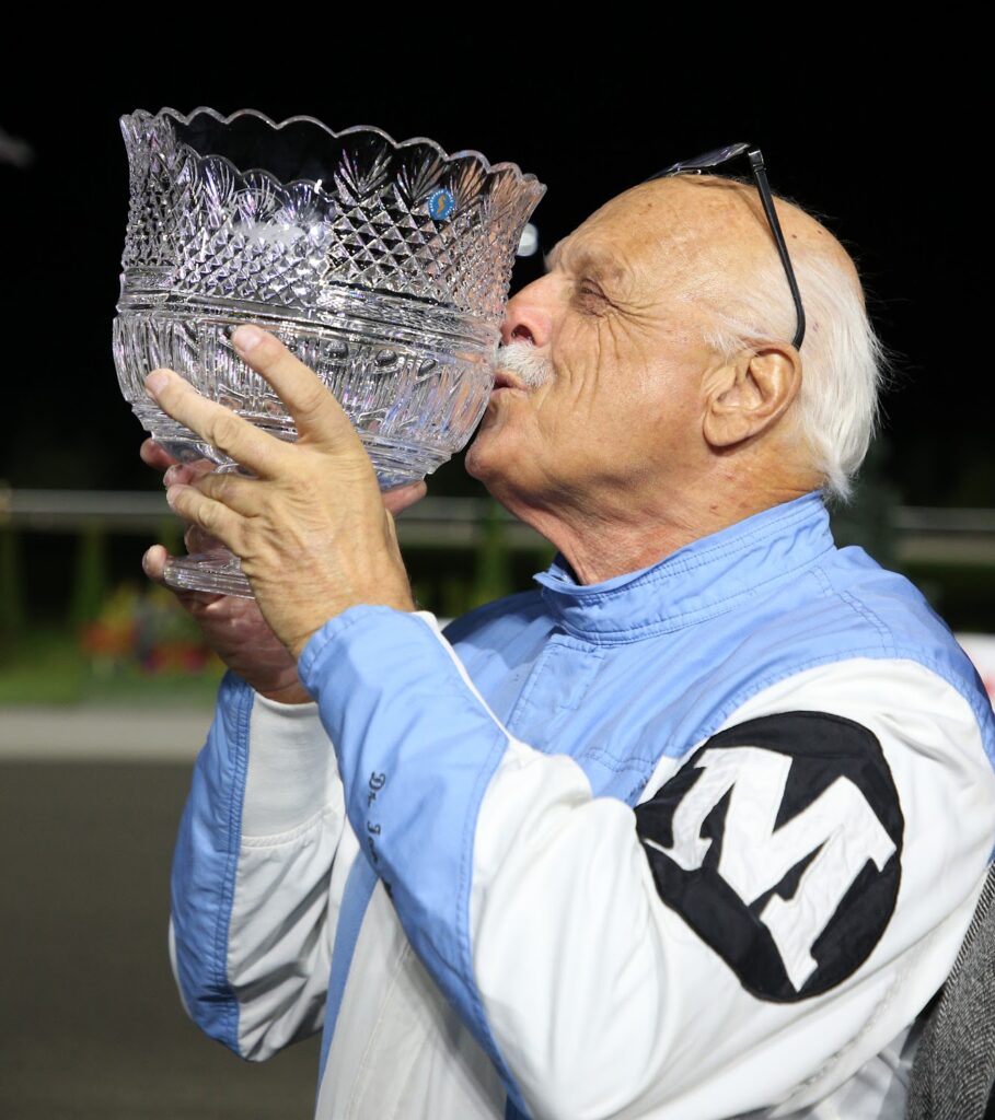 Dr. Ian Moore kisses trophy